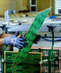 Person holding printed circuit boards